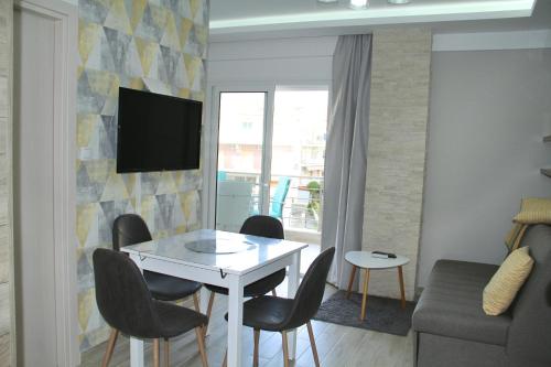 A television and/or entertainment centre at M Apartments, Kallikratia