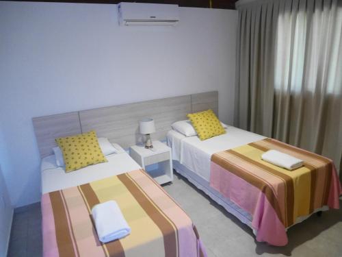 Ένα ή περισσότερα κρεβάτια σε δωμάτιο στο Luxury Villa - Madeiro