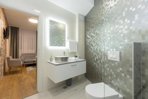 Phòng tắm tại Apartmani i sobe Pejačević