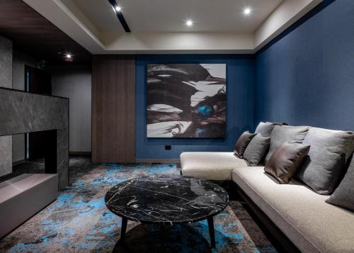 a living room with a couch and a table at Kung Shang Design Hotel in Kaohsiung