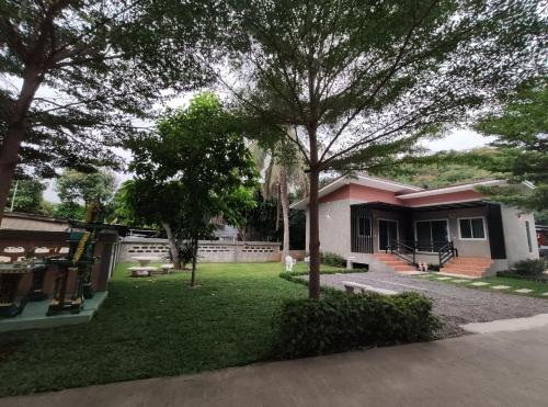 a house with a yard in front of it at No.17 @ Khaoyai in Mu Si