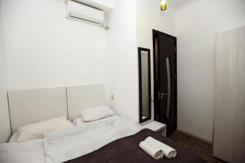 Postel nebo postele na pokoji v ubytování Hotel Rustaveli 36