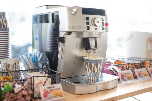 a coffee maker sitting on top of a counter at Uwajima Oriental Hotel in Uwajima