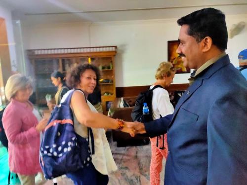 a man shaking the hand of a woman at Paray Village County in Kollengode