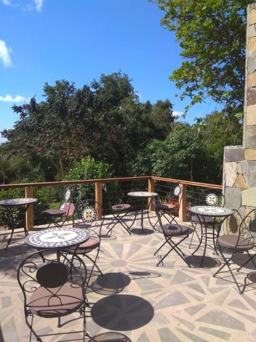 a group of tables and chairs on a patio at Les Antigones in Crève Coeur