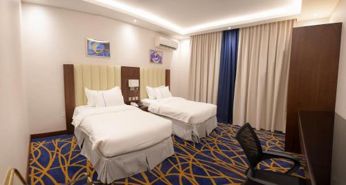 Postel nebo postele na pokoji v ubytování فندق قوبا إن - Quba Inn Hotel