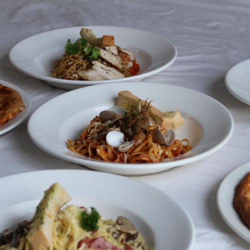 a group of plates of food on a table at Forbis Hotel in Serang