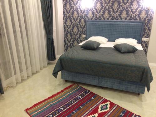 The Cotton Houseにあるベッド