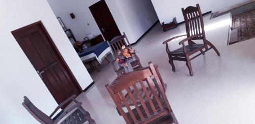 an overhead view of a living room with chairs and a table at Royal beach villa in Unawatuna