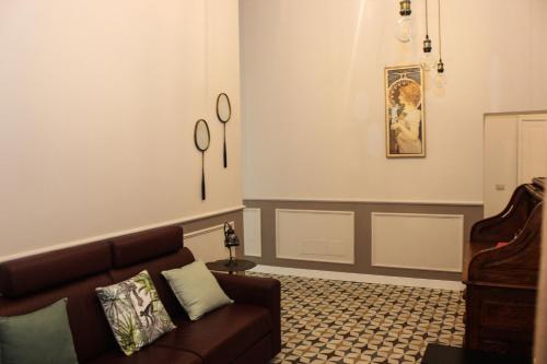 a living room with a couch and a table at Le Chiavi di Casa in Naples
