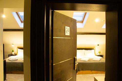 Кровать или кровати в номере Urban Lodge Belgrade