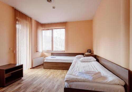 A bed or beds in a room at Rodopi Houses