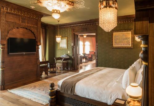 a bedroom with a large bed and a large window at AJWA Sultanahmet in Istanbul
