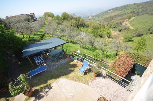 an aerial view of a house with a grill and chairs at CASA PERA in Vinci