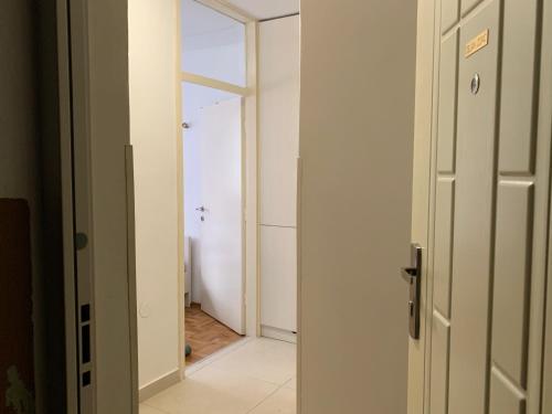 an open door to a hallway in a room at Apartman Olivia in Banja Luka