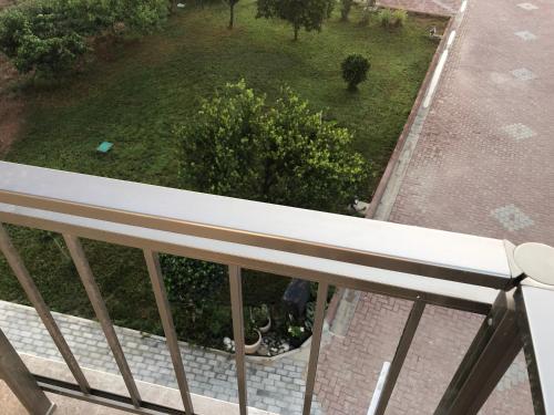 a view of a garden from a balcony at Deniz Airport Suites in North Nicosia