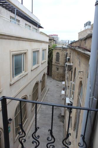 a view of an alley from a balcony at Two Seasons Boutique Hotel Baku in Baku