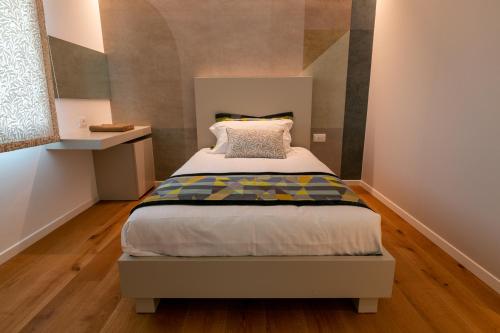 Кровать или кровати в номере Relais Althea Azienda Agrituristica