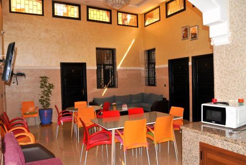 a living room with a table and chairs and a couch at Silia in Marrakesh