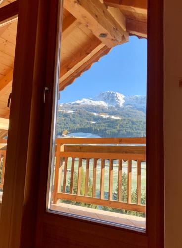 a window view of a mountain from a cabin at Apartment HaNiLe in Sarntal