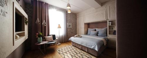 a hotel room with a bed and a window at Libertine Lindenberg in Frankfurt/Main