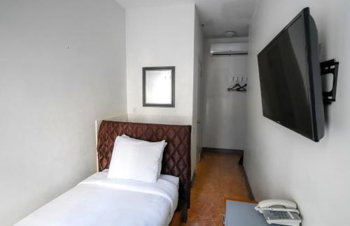 TV a/nebo společenská místnost v ubytování Midtown West Hotel