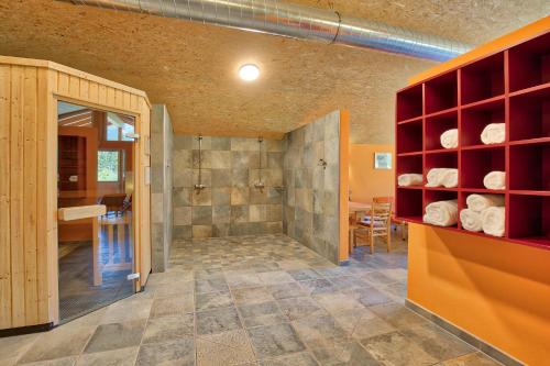 a bathroom with a walk in shower and a walk in closet at Walch's Camping & Landhaus in Braz