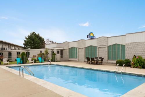 a swimming pool in front of a hotel at Days Inn by Wyndham London in London
