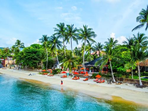 an aerial view of a beach with palm trees at Secret Garden Beach Resort in Bangrak Beach