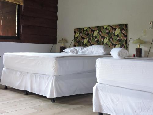 
Ein Bett oder Betten in einem Zimmer der Unterkunft Boca Tapada Lodge
