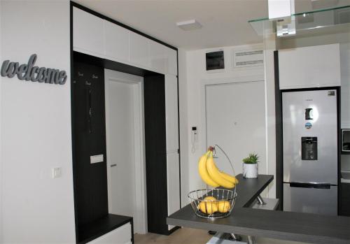a kitchen with a bowl of bananas on a table at Spa Panorama in Belgrade