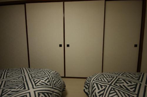 Katil atau katil-katil dalam bilik di 札幌ドーム前ハウス Sapporodome front house
