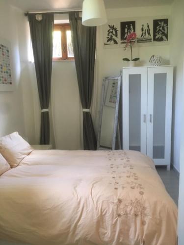 Ліжко або ліжка в номері La Casa di Ornella