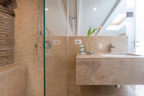 a bathroom with a sink and a shower at Pantheonview - Luxury Suites in Rome