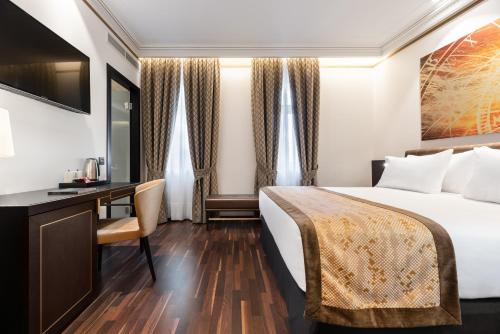 Кровать или кровати в номере Áurea Legends by Eurostars Hotel Company