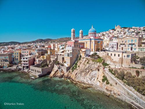 an aerial view of a city on a hill at Galini Rooms & Apartments in Finikas