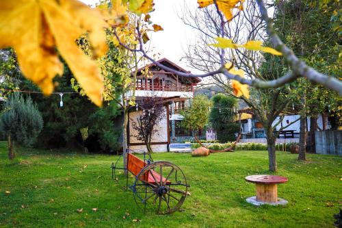 a bench sitting in the grass in front of a house at Rif Sapanca - Adult Only in Sapanca