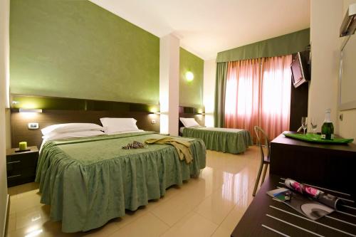 Katil atau katil-katil dalam bilik di Hotel Ideale