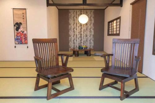 two wooden chairs sitting in a living room at Atami - Hotel / Vacation STAY 56914 in Atami
