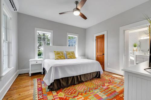 a bedroom with a bed with yellow pillows on it at McKenize Guest House: Inks Suite 1 BD, 1BA in Marble Falls