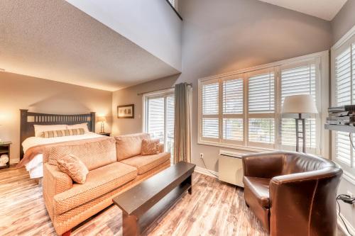 a living room with a couch and a bed at Condo 310 at North Creek Resort in Blue Mountains