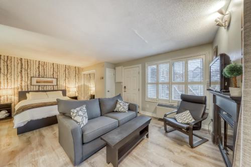 a living room with a couch and a bed at Condo 807 at North Creek Resort in Blue Mountains