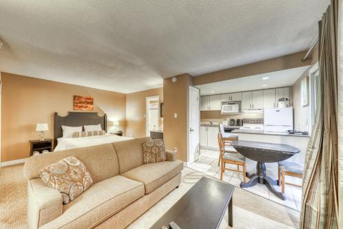 a living room with a couch and a bed and a kitchen at Condo 903 at North Creek Resort in Blue Mountains