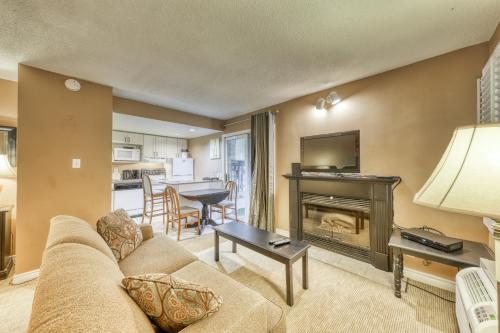 a living room with a couch and a fireplace at Condo 903 at North Creek Resort in Blue Mountains