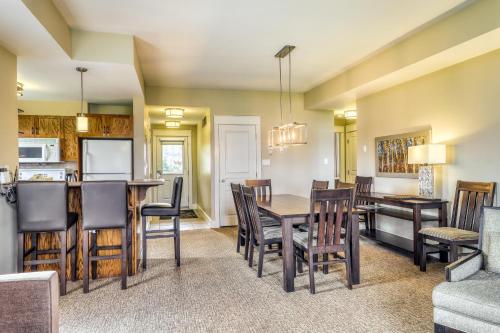 a kitchen and dining room with a table and chairs at Rivergrass 226 in Blue Mountains