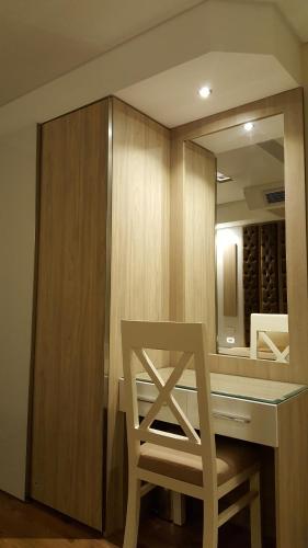 a chair sitting at a table in front of a mirror at Sheraton Ocean 401 - No Pool Access in Cairo