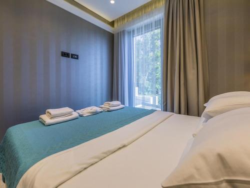 Posteľ alebo postele v izbe v ubytovaní Apartments DEL MAR 5