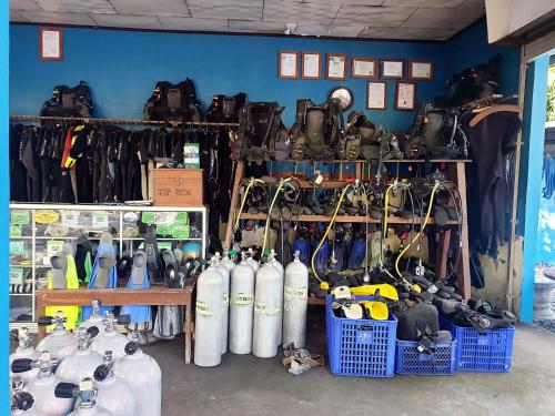 a store filled with lots of gas cylinders and other items at Aqua Dive Paradise in Tulamben