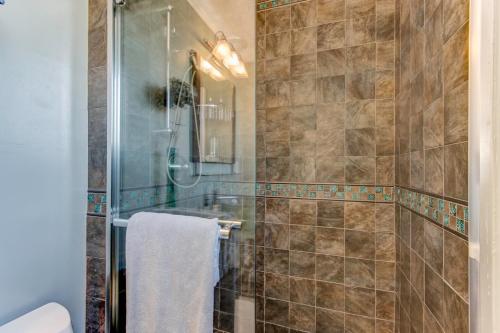 a bathroom with a shower and a sink at House-Canyon Dr in Oceanview