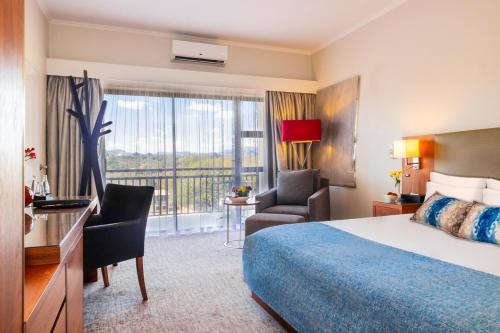 Malawi Sun Hotel & Conference Centreにあるベッド